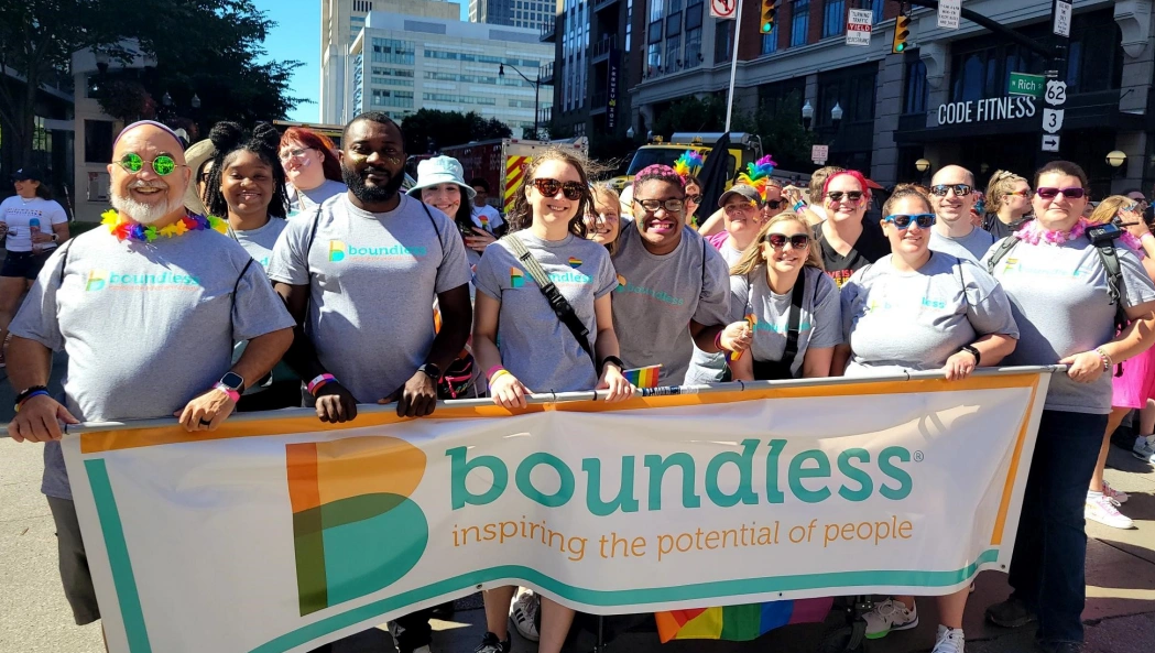 Group holding the Boundless flag at a Pride Parade 2024